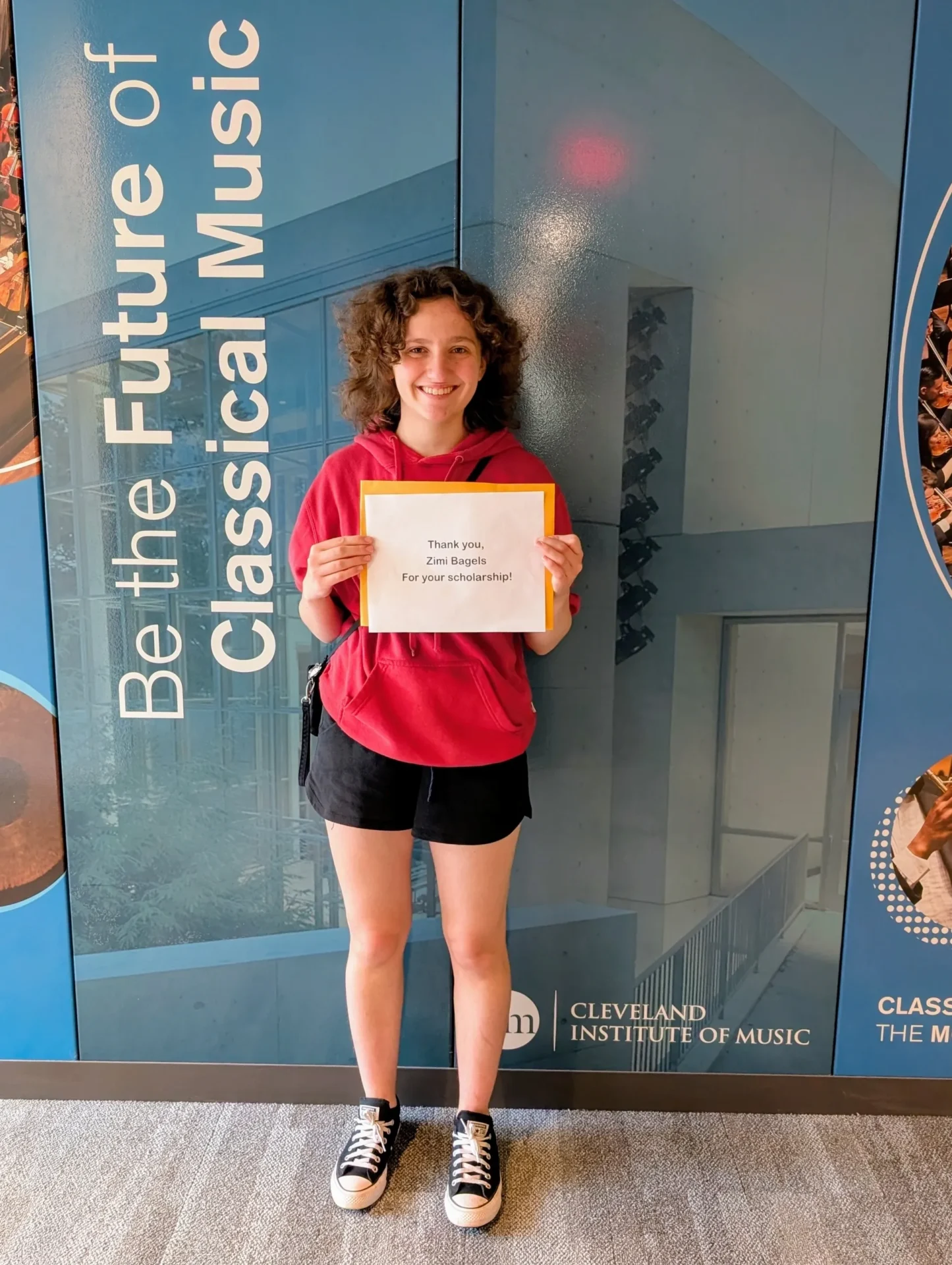 NT Zimi Scholarship 2025 Maren Savino Young woman holding papers.